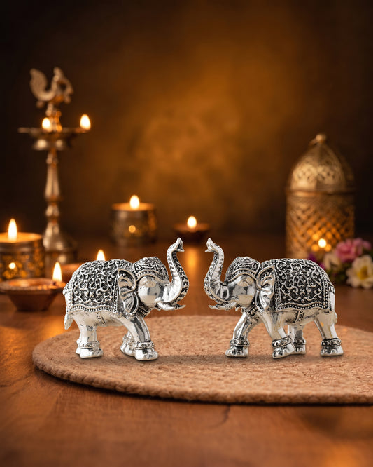 Handcrafted Nakshi Elephant Pair with Raised Trunks in Brass | Premium Silver Finish | Luxury Vastu Décor